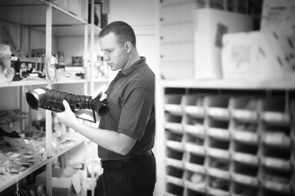 Man With Vehicle Part For Fleet Conversion BW