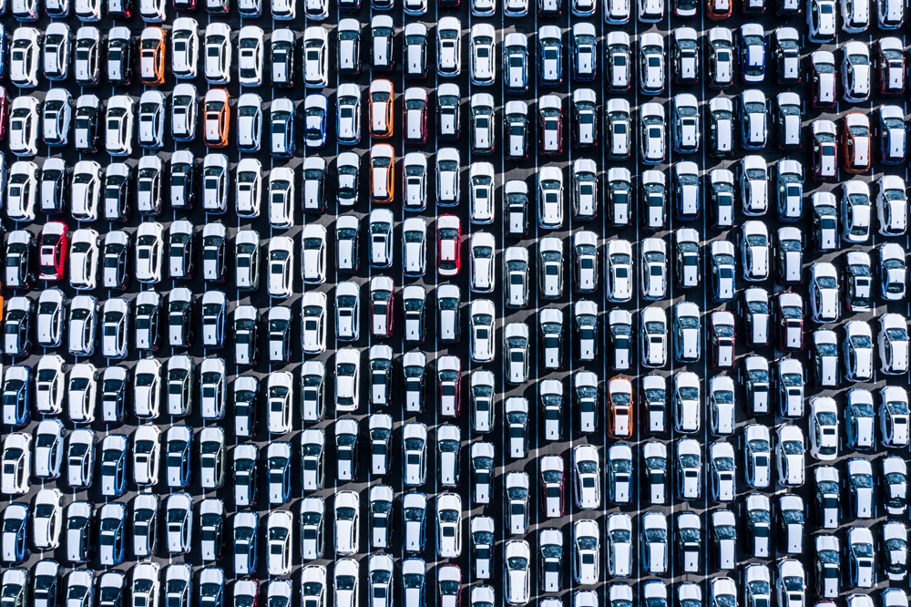 Overhead View Of Hundreds Of New Cars Logistics